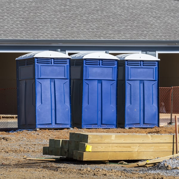 what is the cost difference between standard and deluxe portable restroom rentals in Woodville Texas